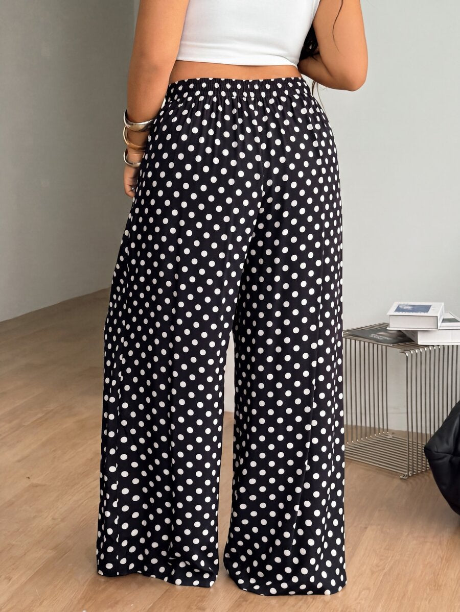 Plus size women's striped loose straight leg cropped pants with pleated detailing and side pockets