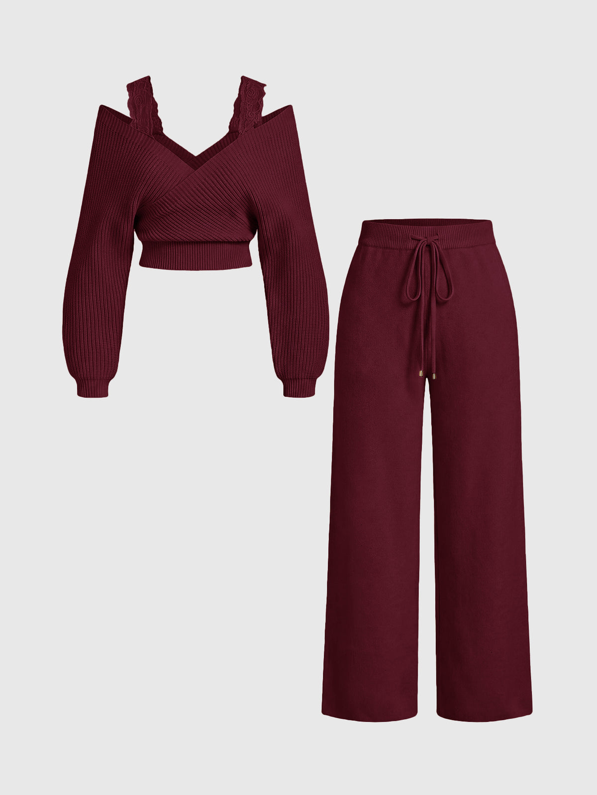 Women's two-piece rib-knit sweater set featuring a long-sleeve cold-shoulder crop top with strap details and matching wide-leg pants.