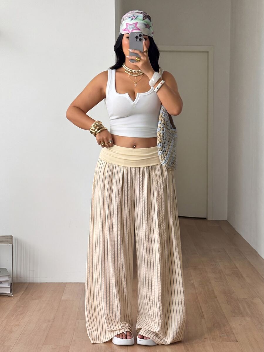 Women's plus size wide leg cotton pants featuring a relaxed loose fit and high waist design.