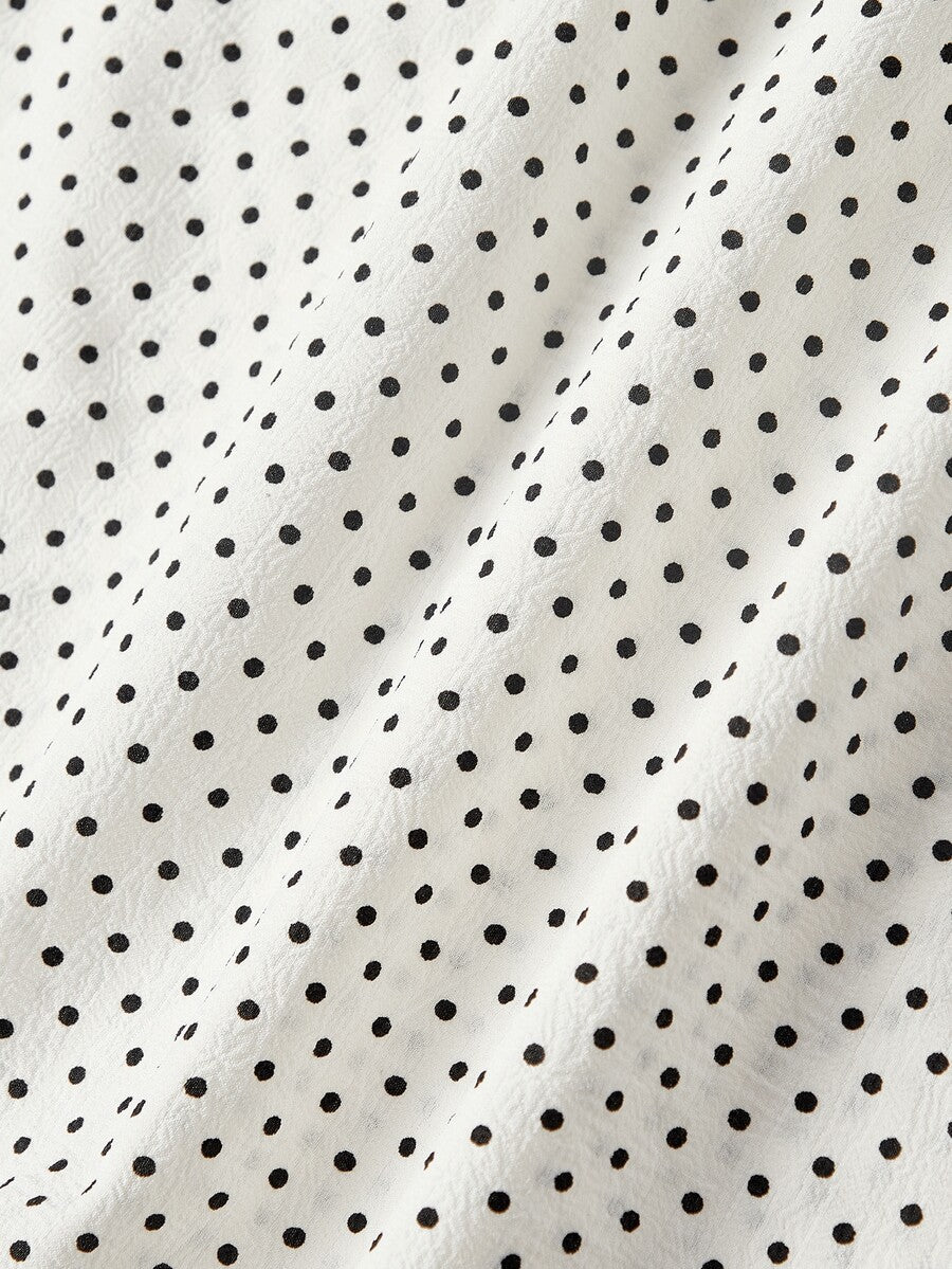 Short sleeve plaid shirt for women featuring a Peter Pan collar with a bow accent, puff sleeves, and a flared hem.