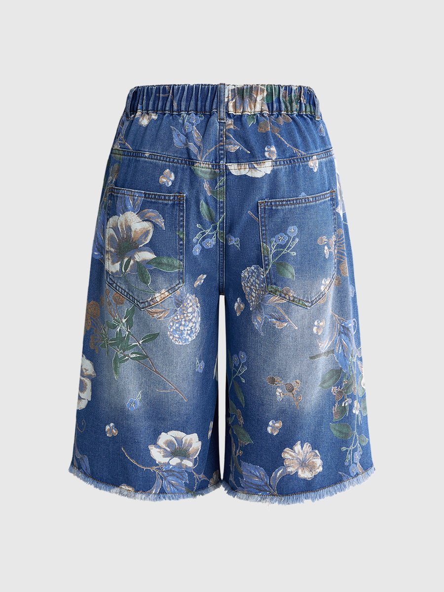 Women's loose wide-leg denim Bermuda shorts featuring vintage animal and paisley print with pockets and zipper fly.
