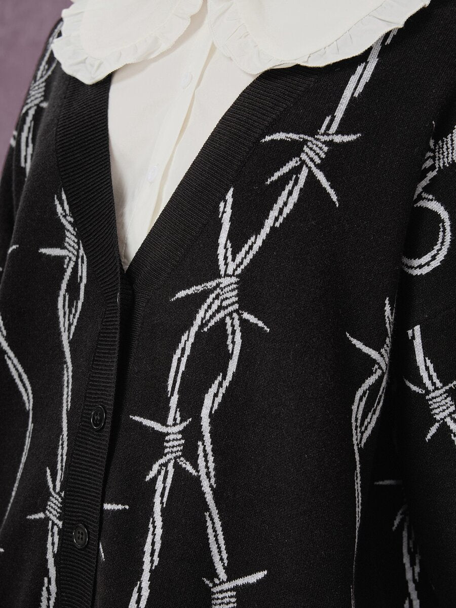 Women's oversized gothic thorn jacquard knit cardigan with V-neckline, button-front closure, and long drop-shoulder sleeves.
