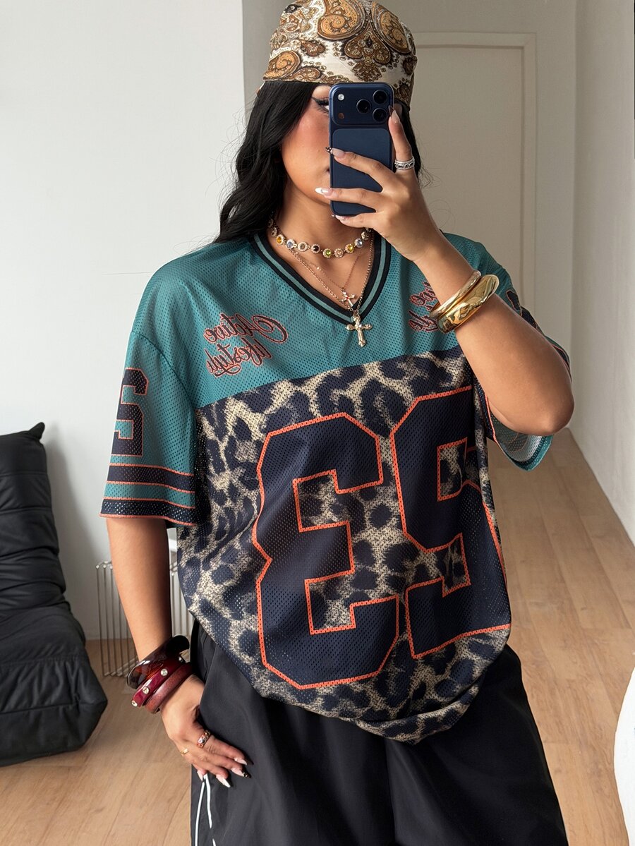 Navy blue plus size mesh baseball jersey t-shirt featuring a V-neck, raglan half sleeves, and sporty letter detailing.