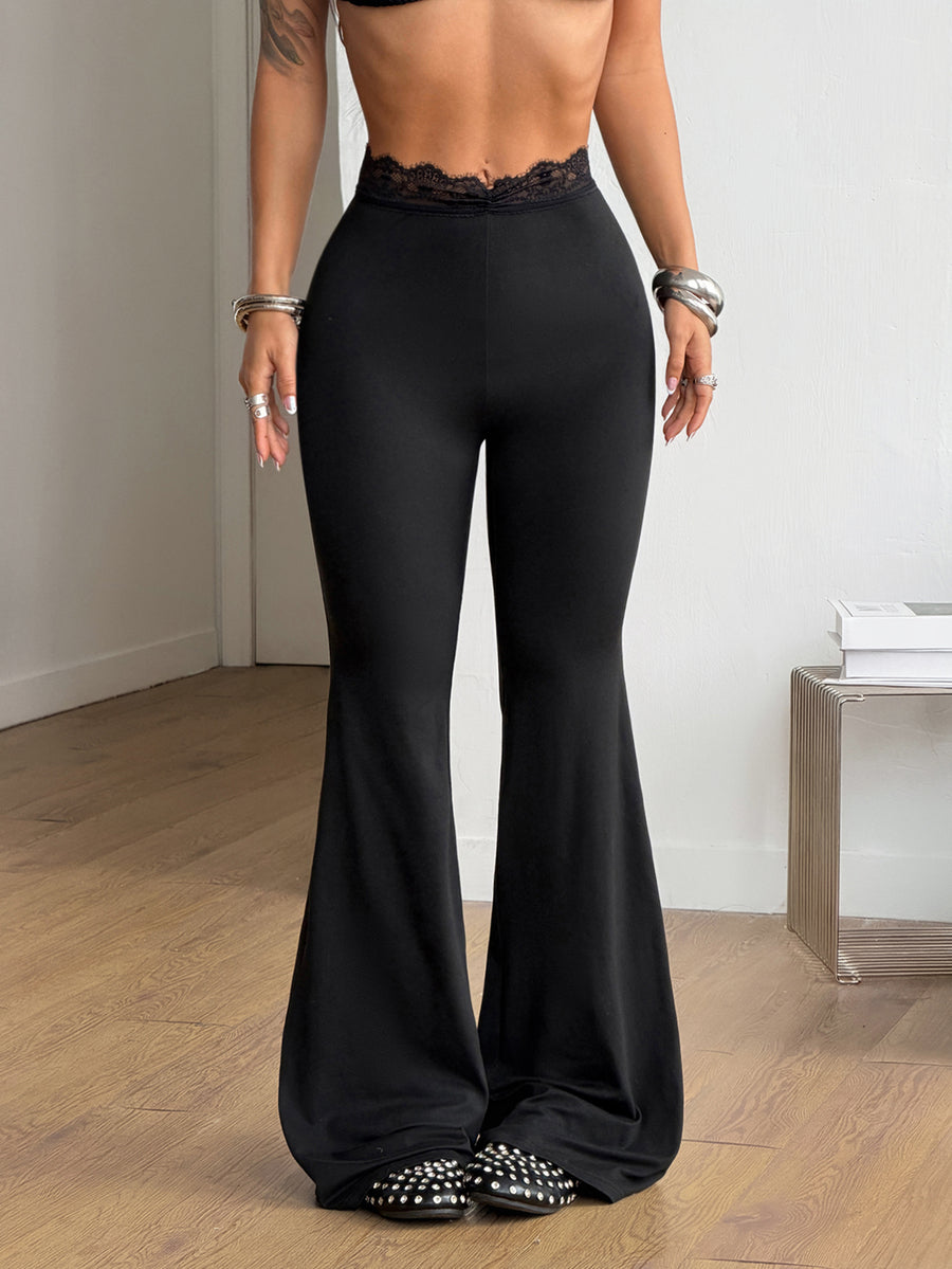Women's plus size black flare leg pants with high elastic waist in stretchy knit fabric