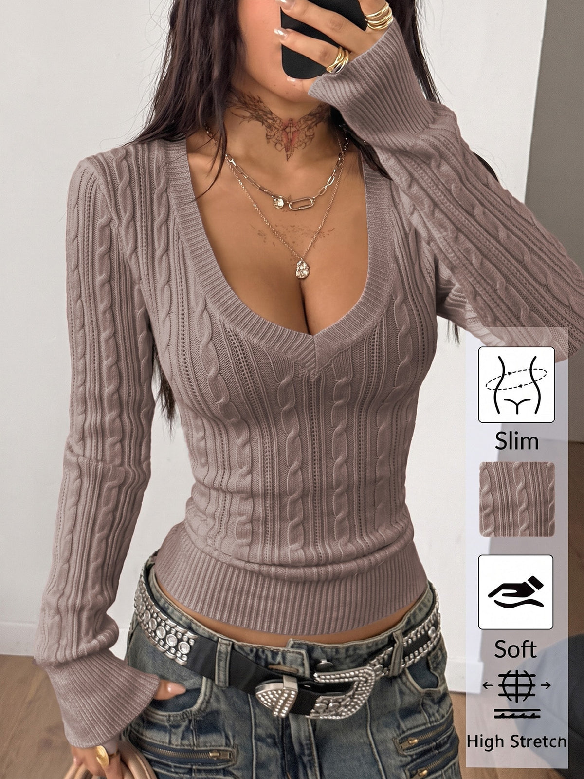 Women's slim fit cable-knit long sleeve sweater featuring a V-neckline and ribbed knit details.