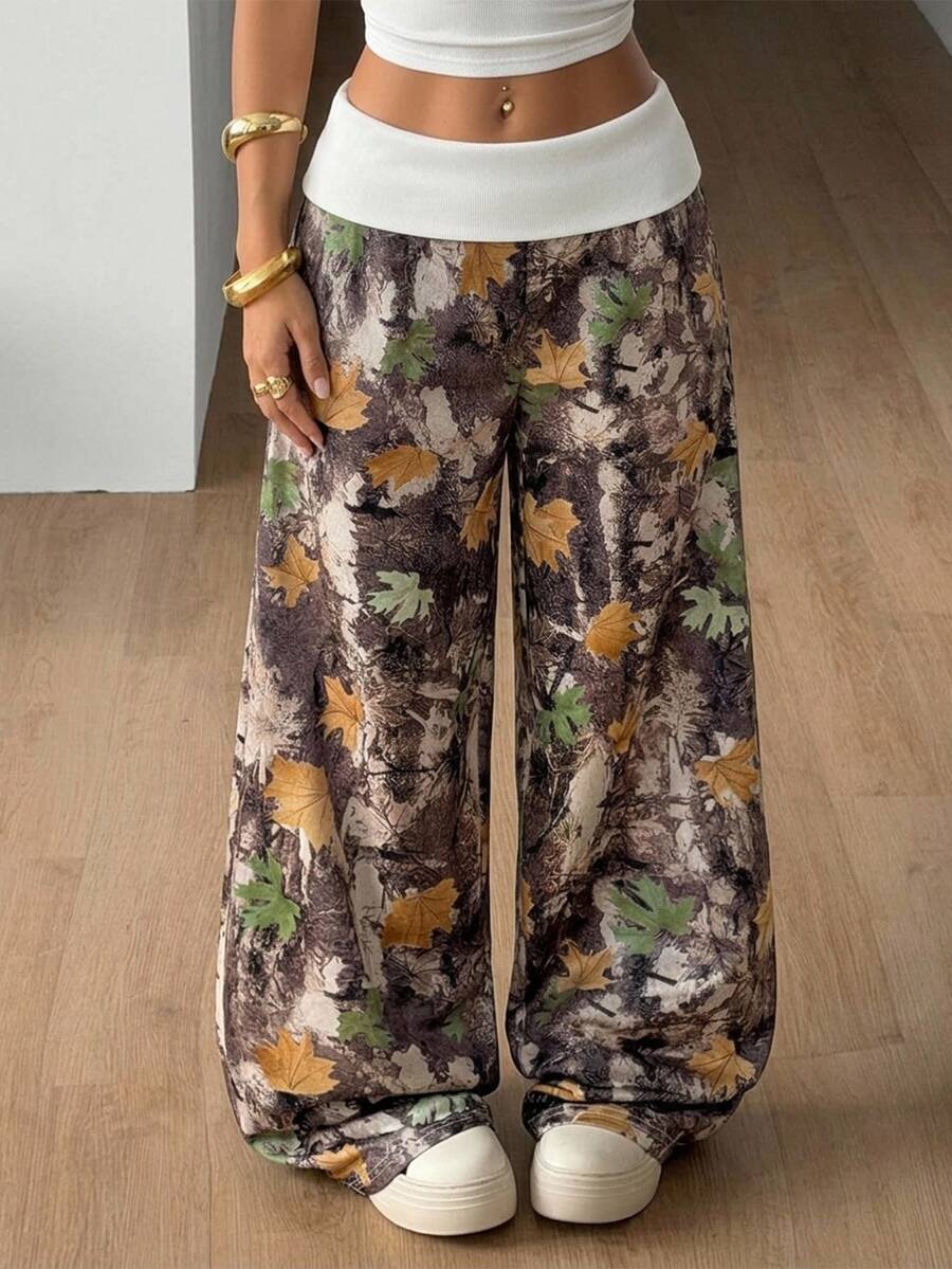 Women's wide leg trousers with a tree branch graphic pattern, loose fit, and mid-rise waist in woven fabric.