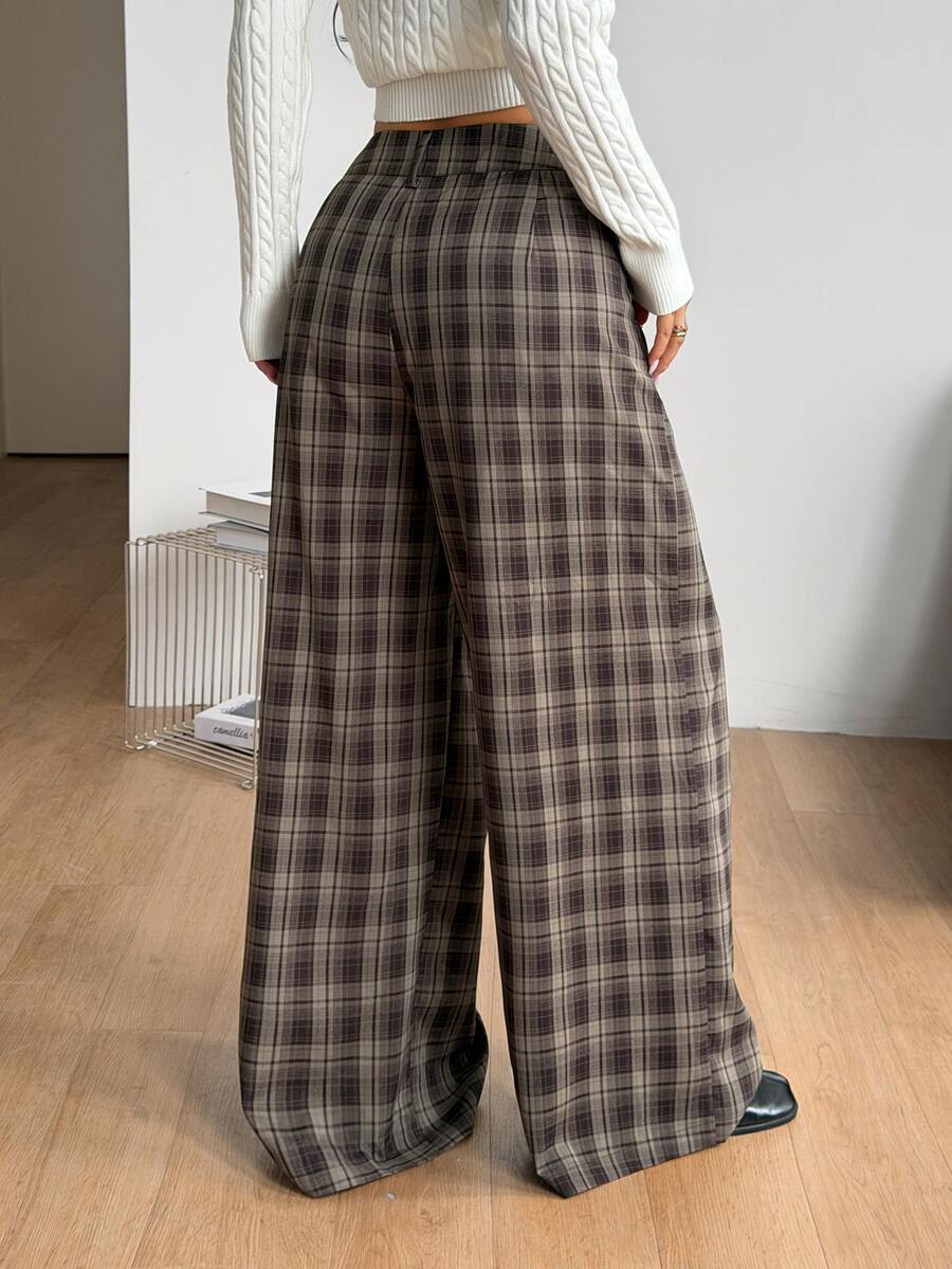 Women's casual straight leg striped woven pants featuring a low waist and zipper fly closure.