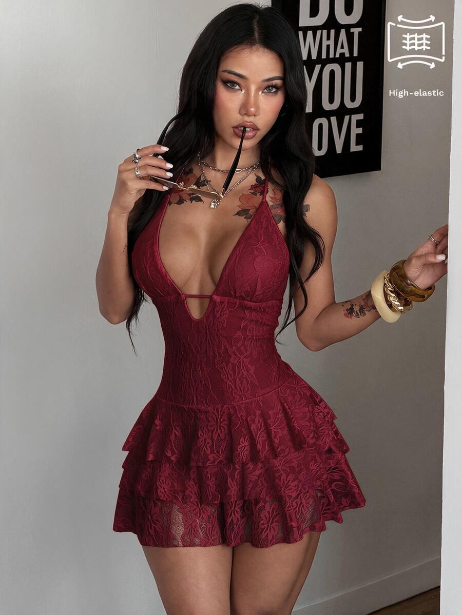 Front view of a women's lace halter mini dress featuring a slim-fit bodice, flared hem, and sleeveless design.