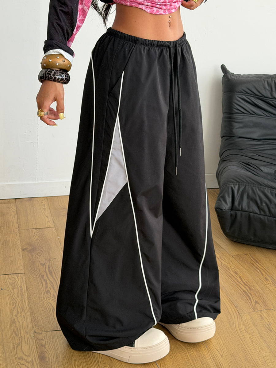 Plus size loose straight leg casual pants with elastic drawstring waist, contrast binding, and side pockets.