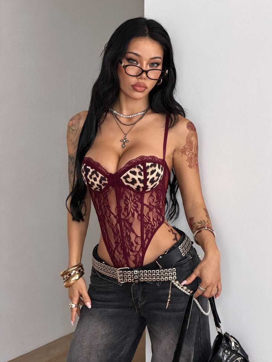 Fitted women's lace and mesh cami bodysuit with spaghetti straps.