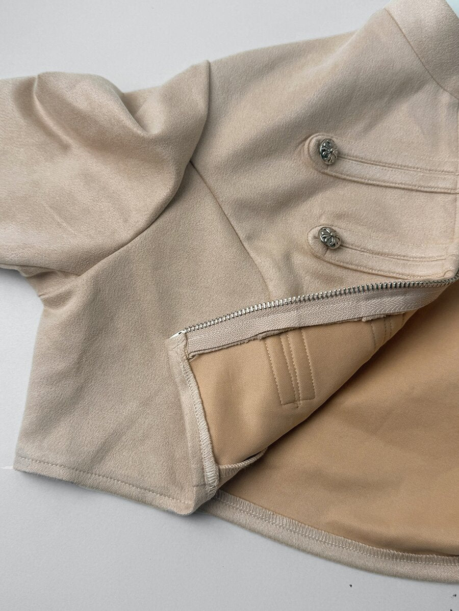 Women's metallic grey cropped faux leather jacket featuring a stand collar and asymmetrical zip front closure.