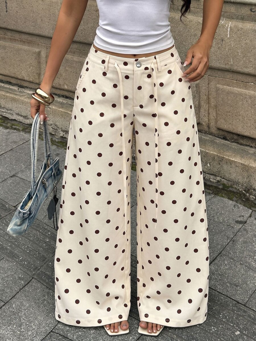 Women's casual straight leg striped woven pants featuring a low waist and zipper fly closure.