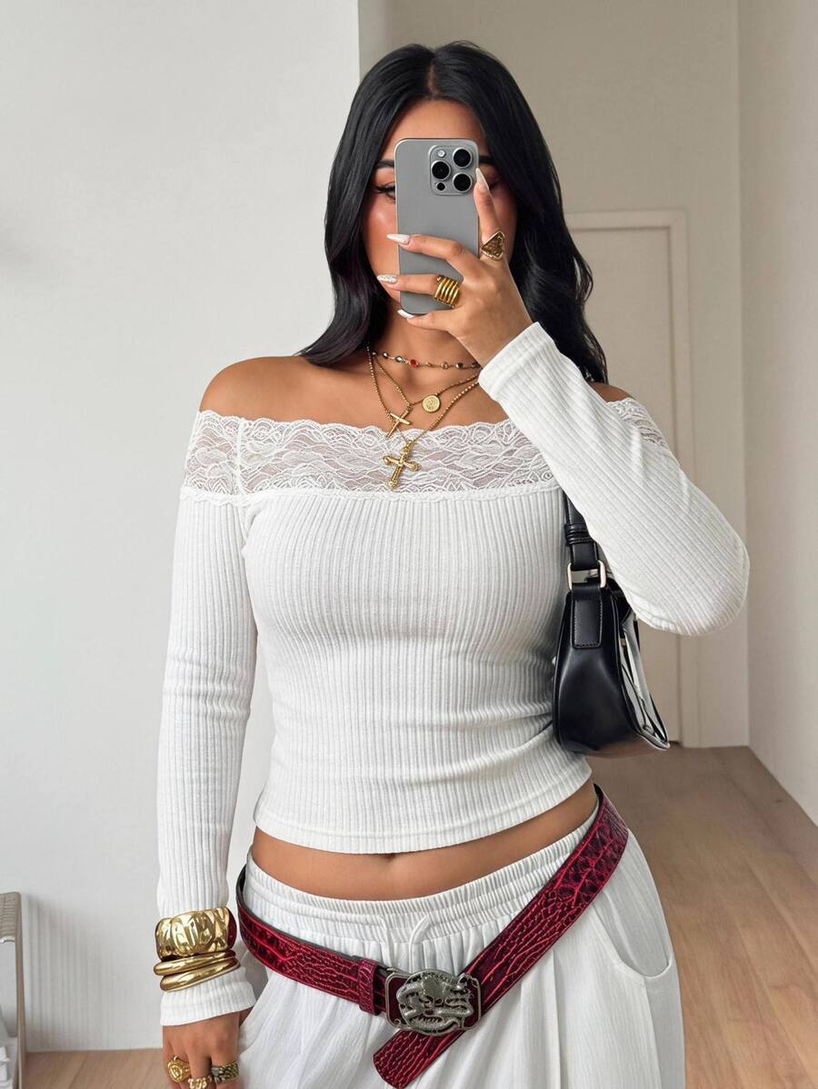 Women's striped off the shoulder long-sleeve top with contrast lace trim and ribbed knit texture.