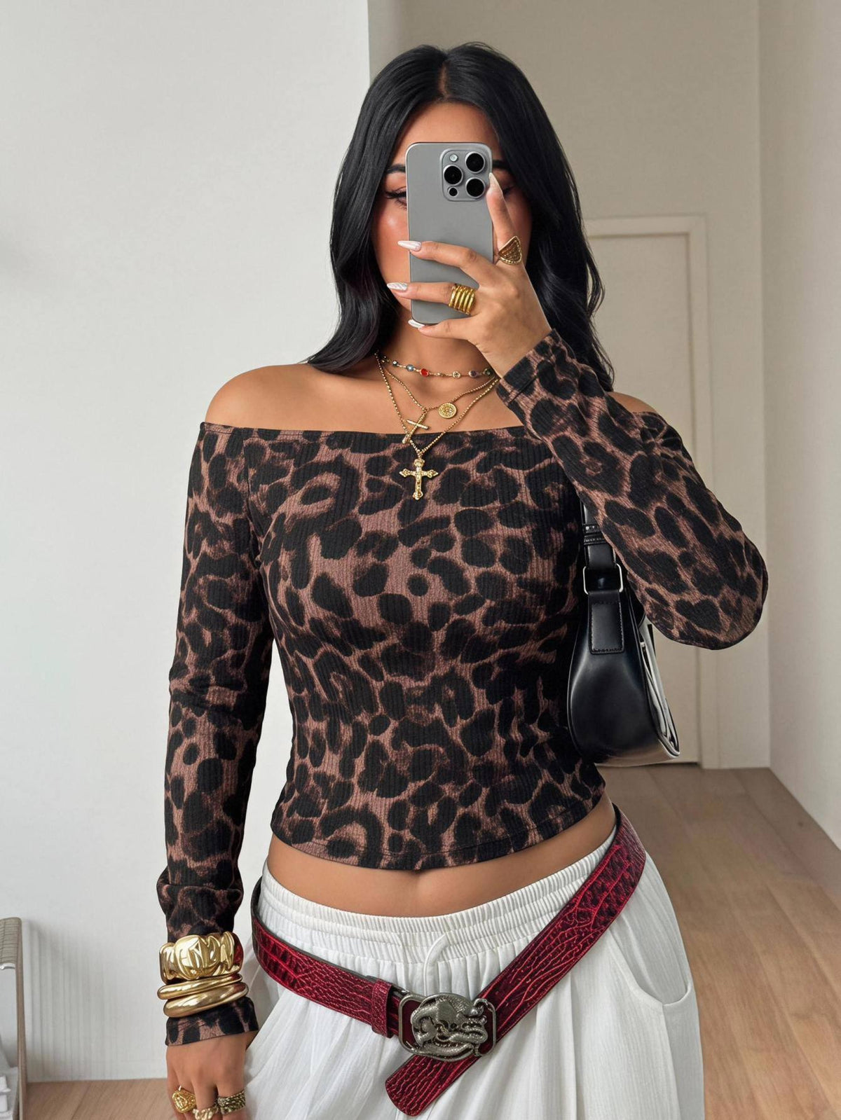 Women's striped off the shoulder long-sleeve top with contrast lace trim and ribbed knit texture.