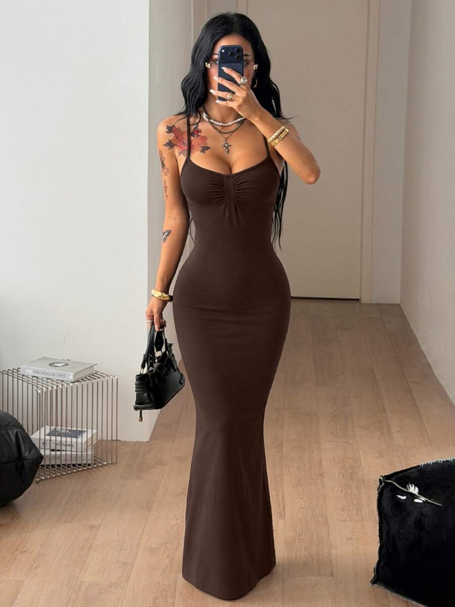 Women's slim fit sleeveless spaghetti strap maxi dress in brown ribbed stretch knit fabric.