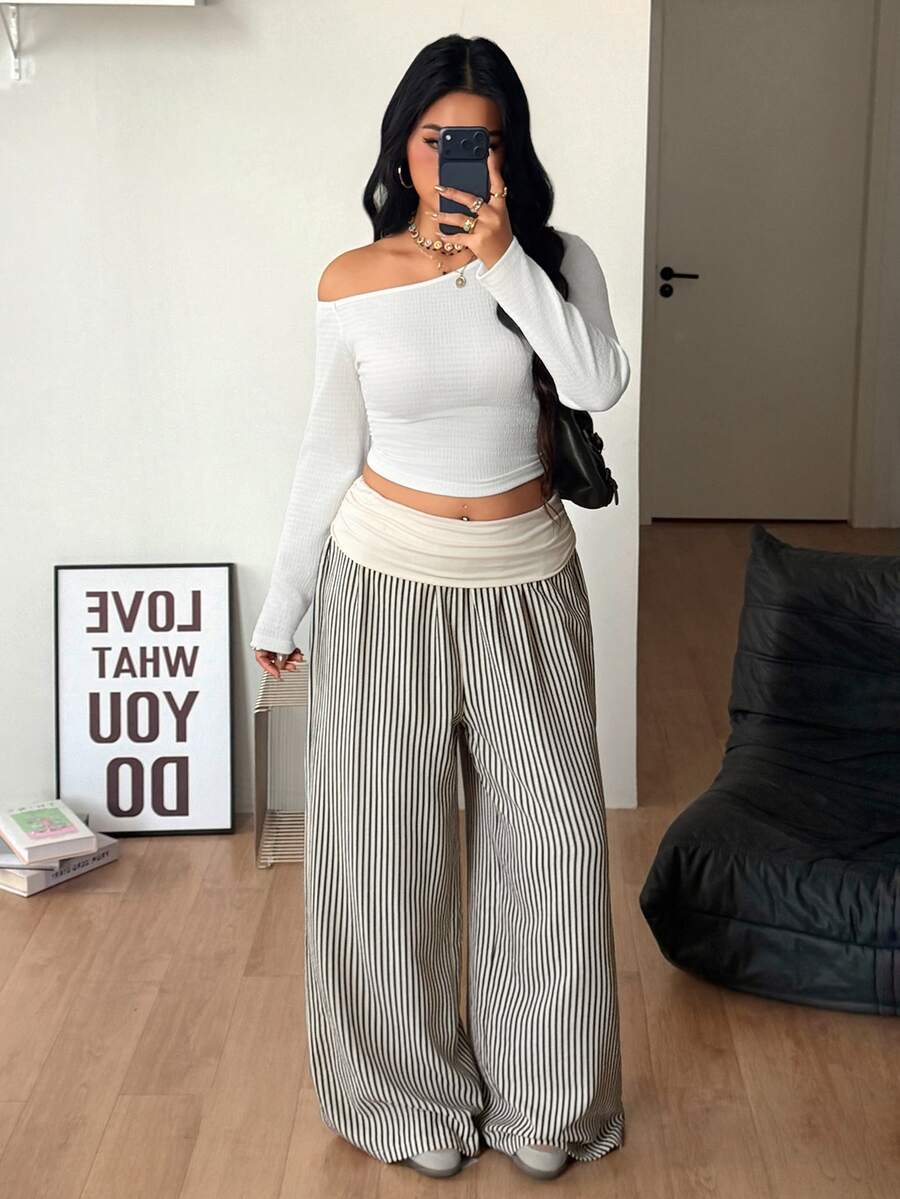 Women's plus size wide leg cotton pants featuring a relaxed loose fit and high waist design.