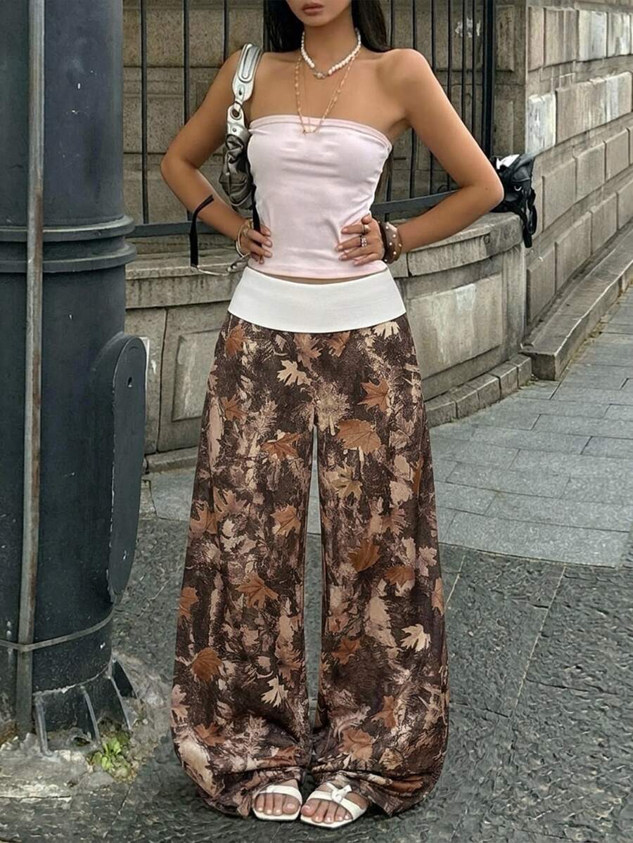Women's wide leg trousers with a tree branch graphic pattern, loose fit, and mid-rise waist in woven fabric.