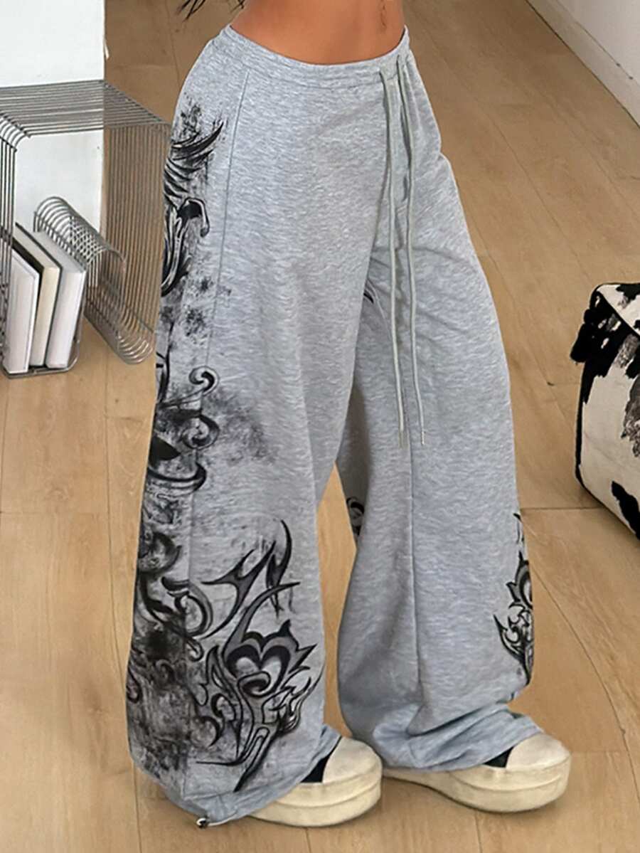 Women's loose fit wide leg graphic sweatpants in light grey with an elastic drawstring waistband