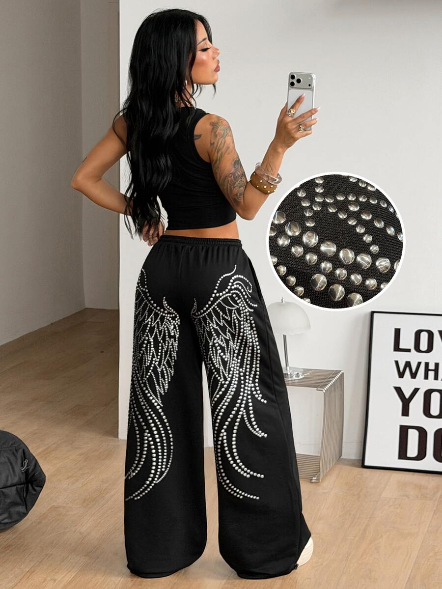 Women's loose fit wide leg graphic sweatpants in light grey with an elastic drawstring waistband