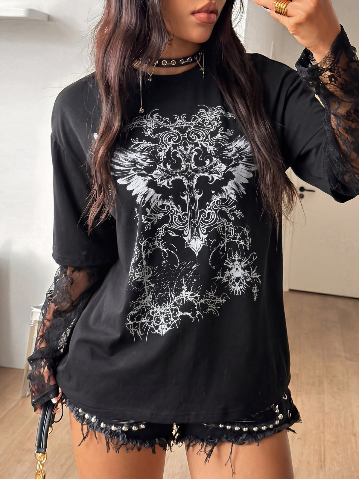 Women's casual graphic long sleeve t-shirt with a round neck, drop shoulder sleeves, and loose relaxed fit.