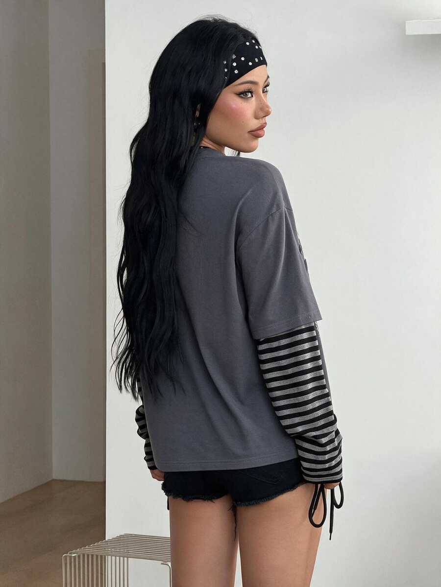 Women's casual graphic long sleeve t-shirt with a round neck, drop shoulder sleeves, and loose relaxed fit.