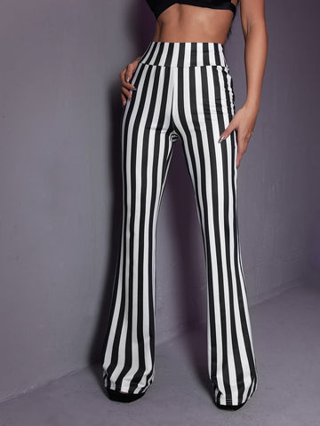 Women's black and white striped flare leg pants featuring a high elastic waist and extra long cut.