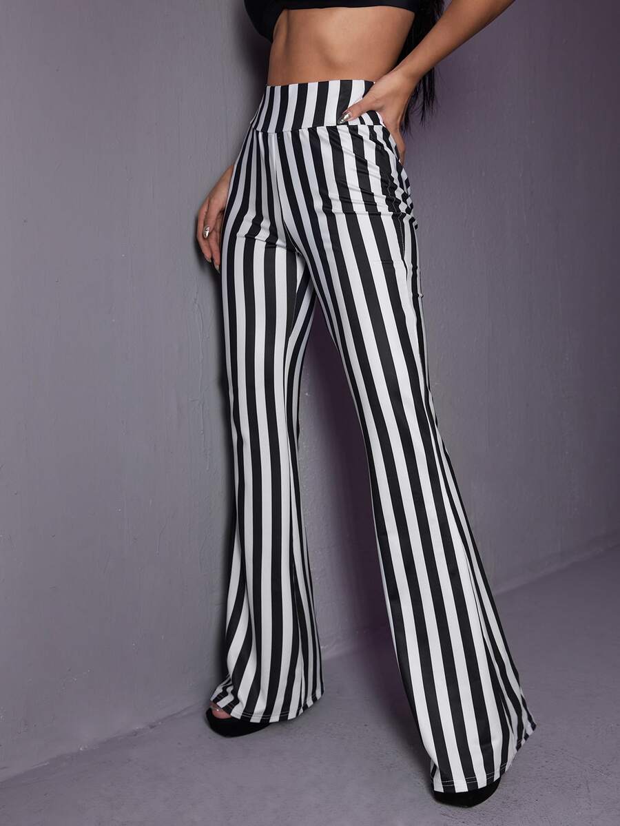 Women's black and white striped flare leg pants featuring a high elastic waist and extra long cut.