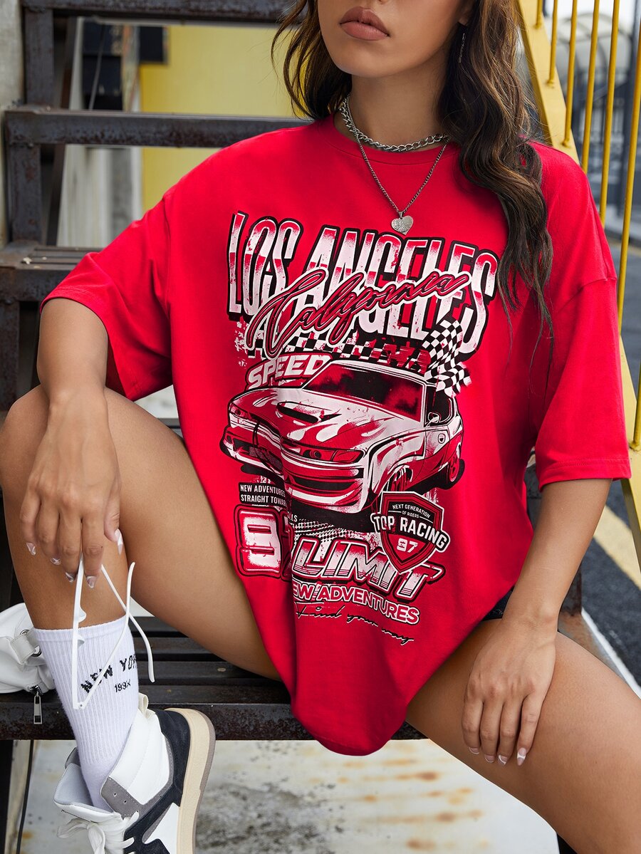 Red oversized t-shirt with letter graphic print and drop shoulder half sleeves.