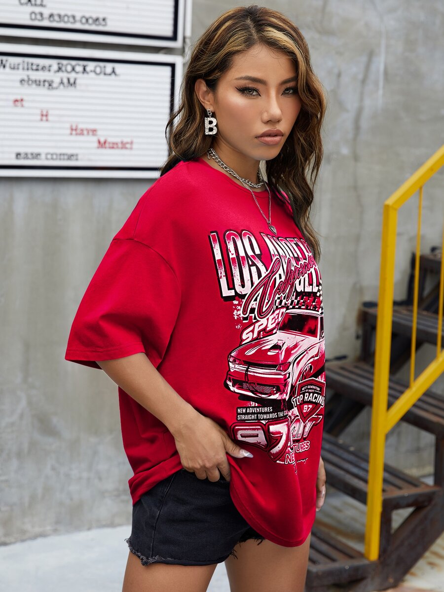 Red oversized t-shirt with letter graphic print and drop shoulder half sleeves.
