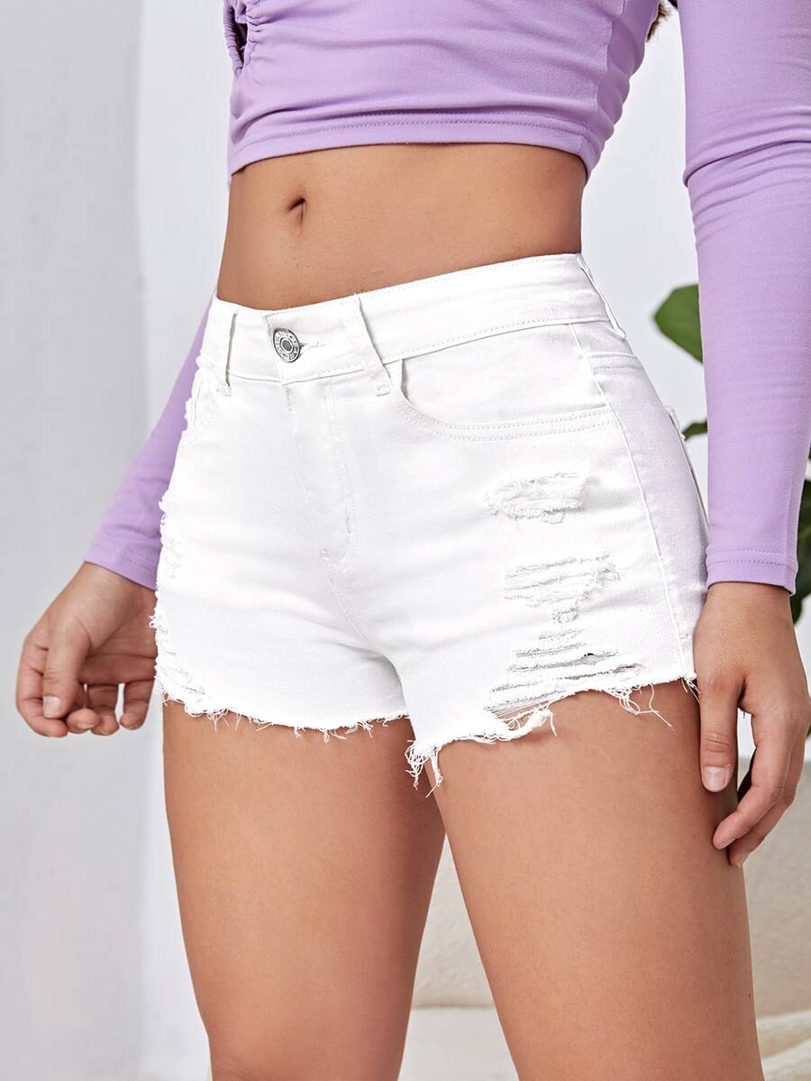 Women's solid color shorts with zipper fly, button closure, pockets, ripped details, and raw hem in a casual straight-leg short length