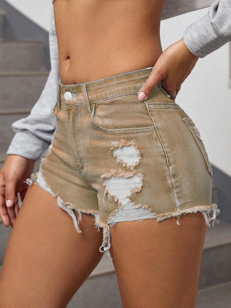 Women's solid color shorts with zipper fly, button closure, pockets, ripped details, and raw hem in a casual straight-leg short length