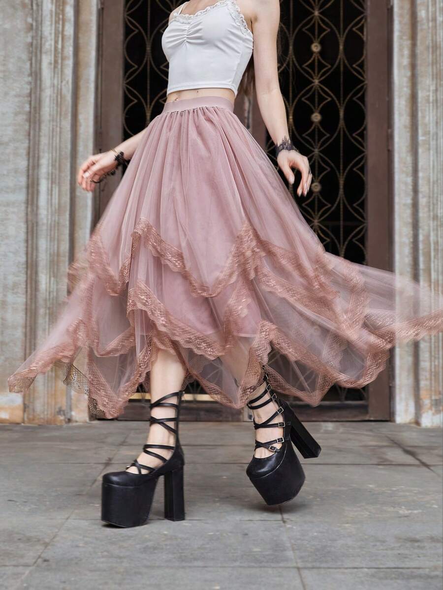 Women's asymmetrical high-waist mesh long skirt featuring contrast lace trim and a tiered A-line silhouette.