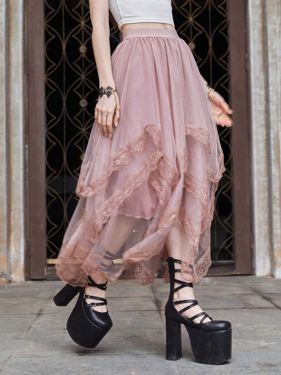 Women's asymmetrical high-waist mesh long skirt featuring contrast lace trim and a tiered A-line silhouette.