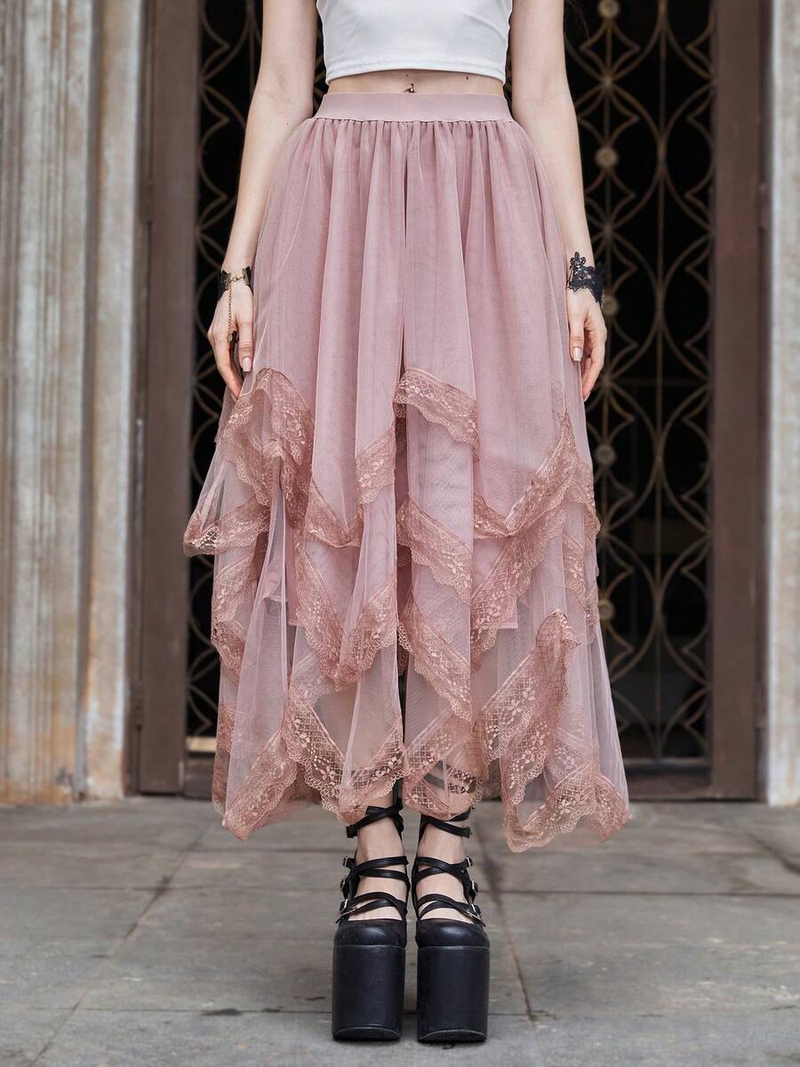 Women's asymmetrical high-waist mesh long skirt featuring contrast lace trim and a tiered A-line silhouette.