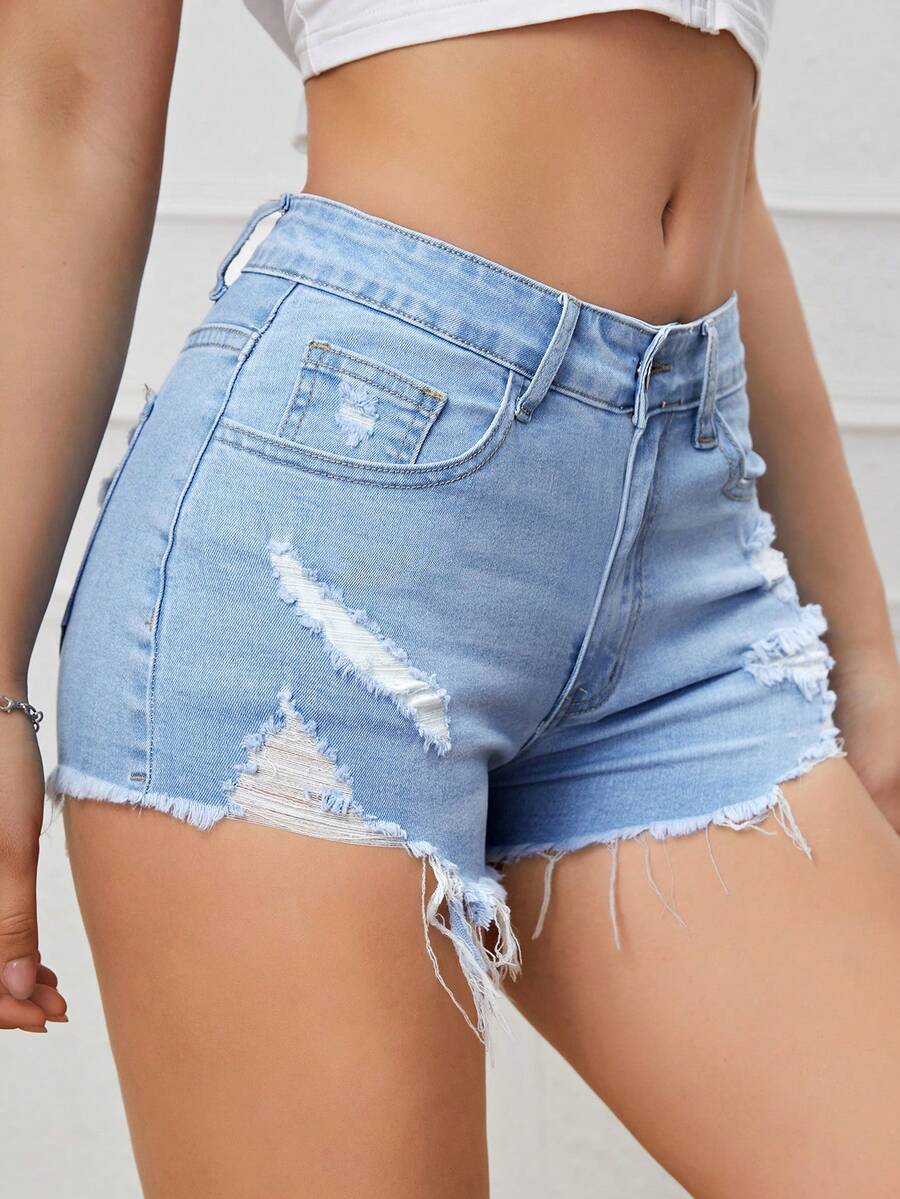 Women's solid color shorts with zipper fly, button closure, pockets, ripped details, and raw hem in a casual straight-leg short length