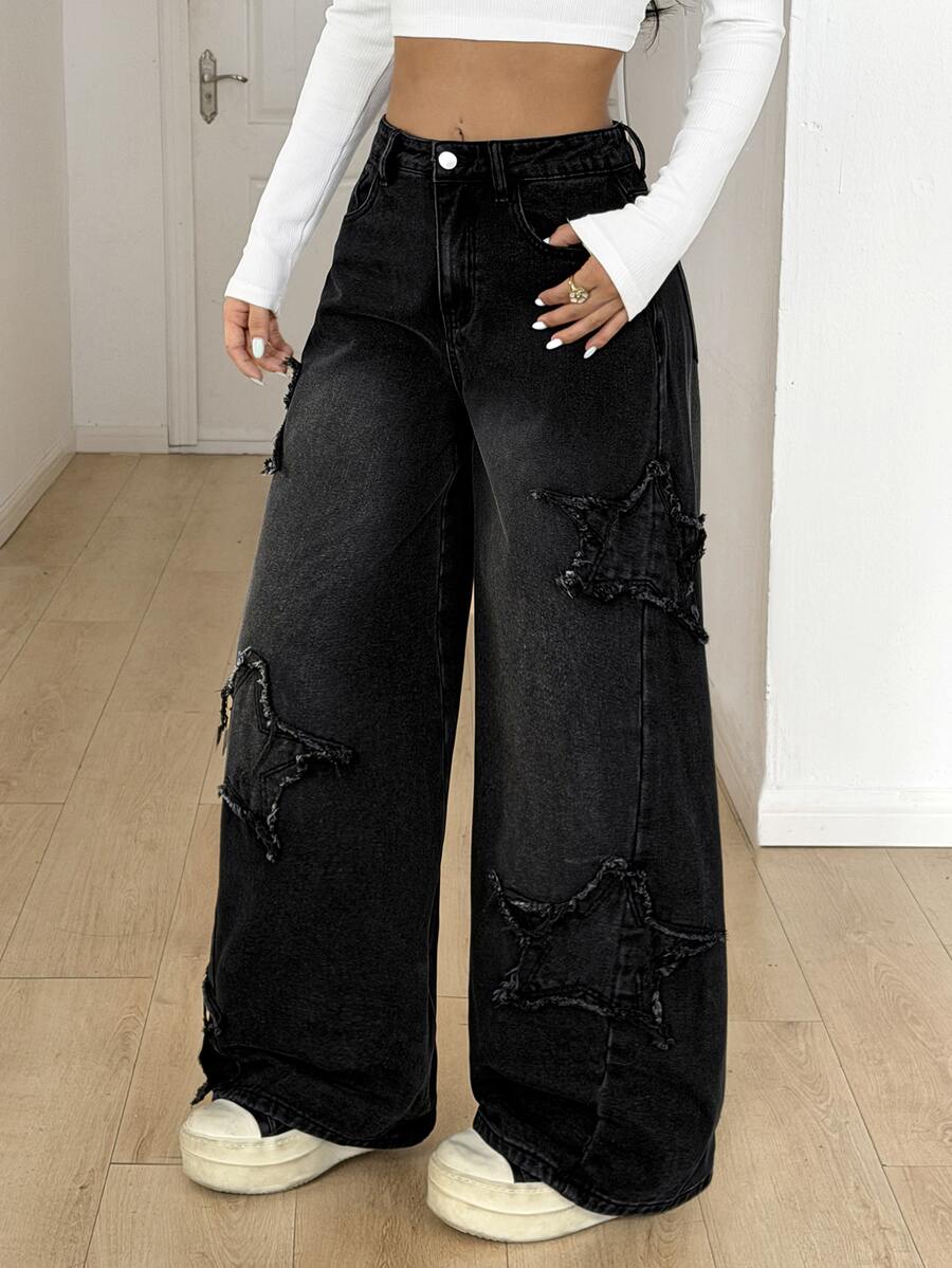 Front view of women's loose wide leg denim jeans featuring a mid waist, classic front pockets, and a zipper fly closure.