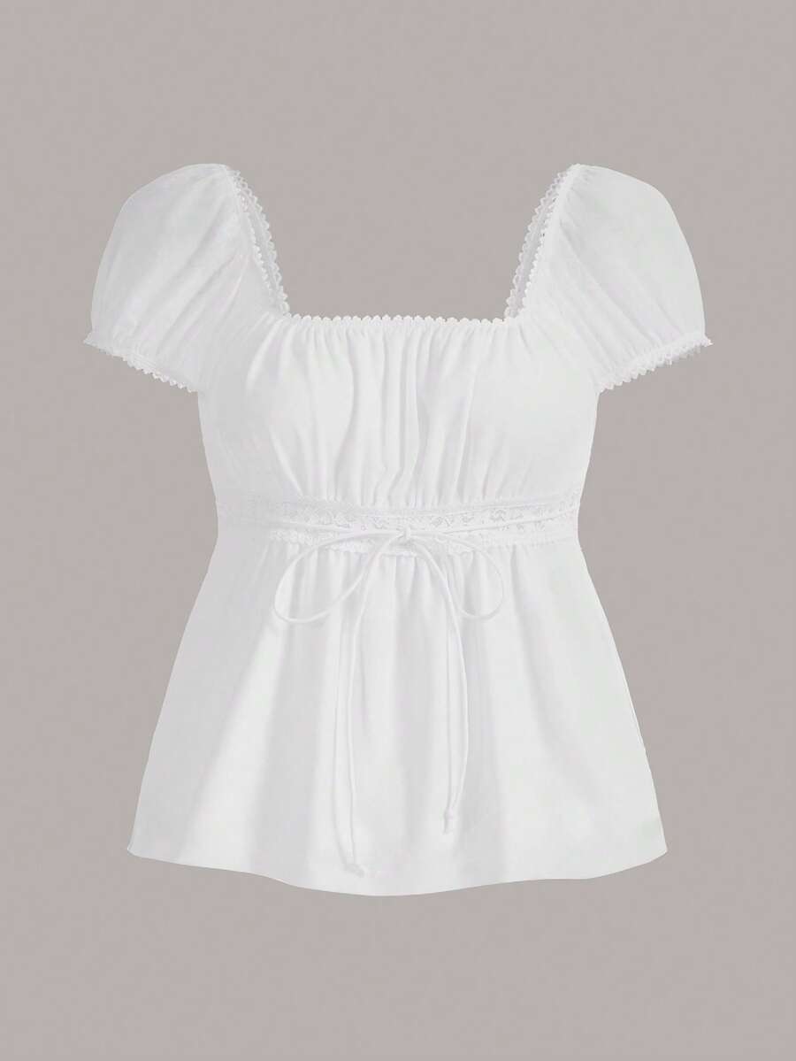 Women's black short puff sleeve top featuring a square neckline, ruched bust detail, and flared ruffle hem.