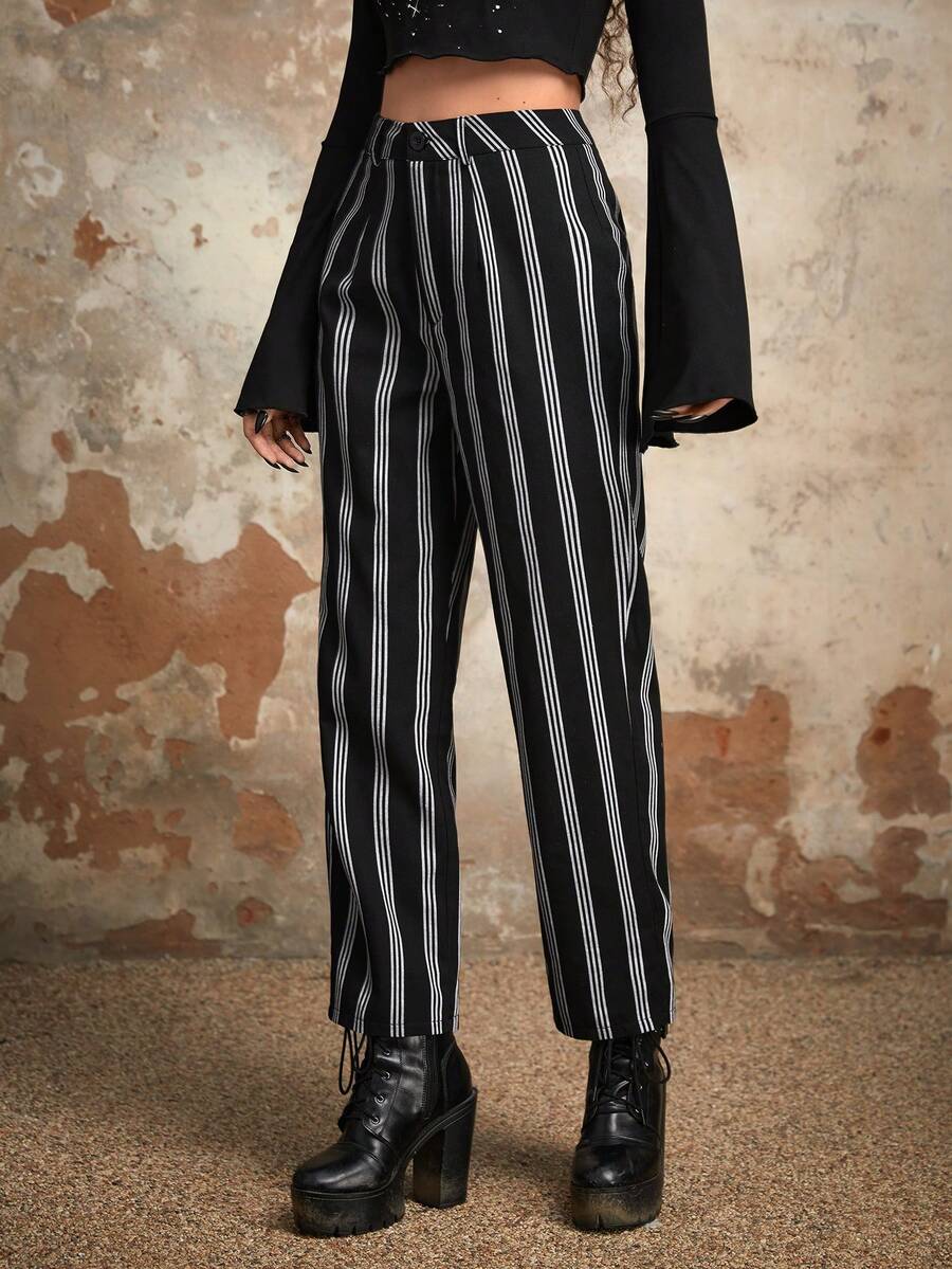 Women's black and white striped straight leg pants featuring a mid waist, regular fit, and zipper fly closure.