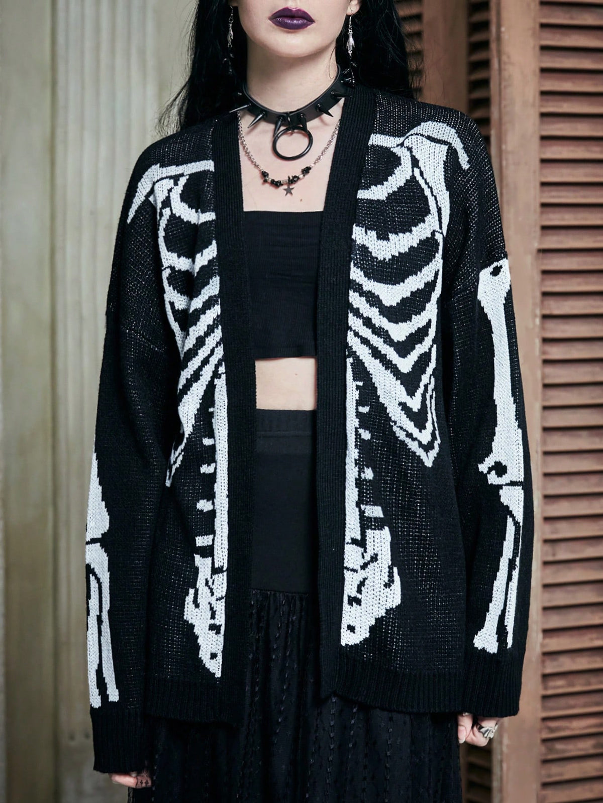 Women's oversized skeleton pattern cardigan with long drop shoulder sleeves and rib-knit trim