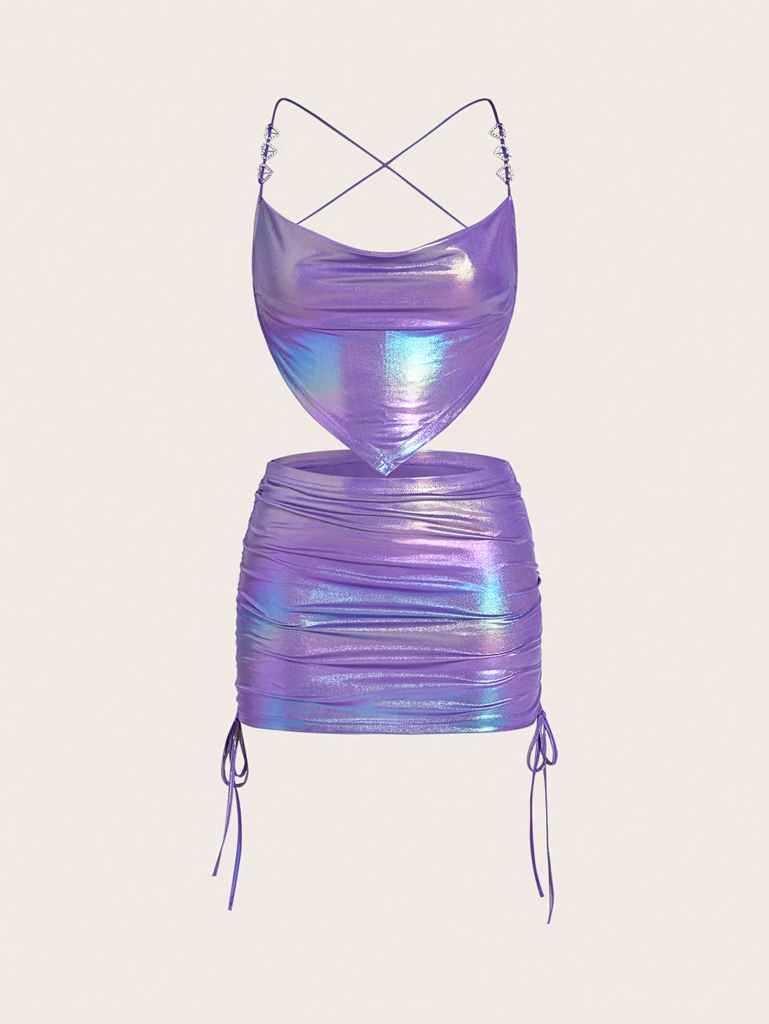 Holographic metallic two-piece set with a spaghetti strap hanky hem crop cami top and drawstring side skirt, featuring ruched details and rhinestone accents.