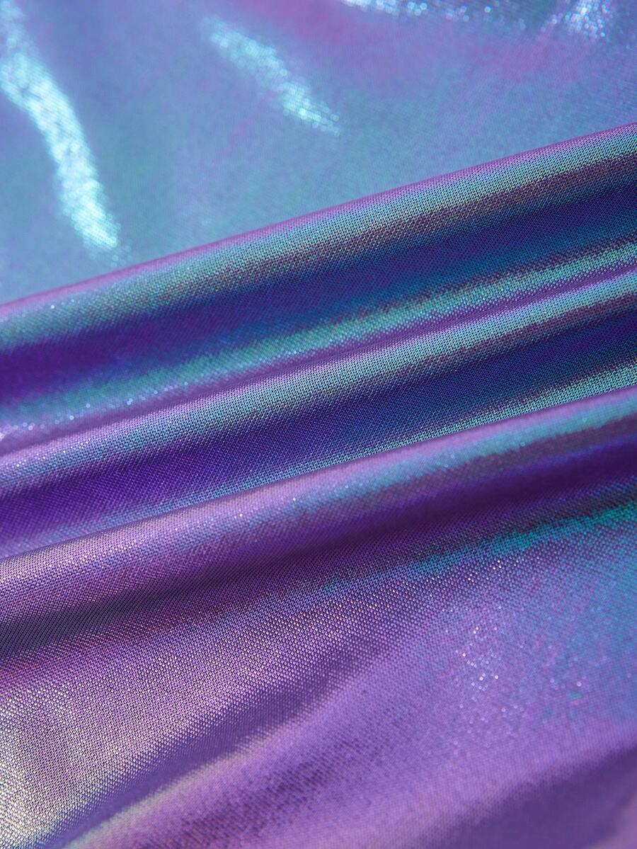 Holographic metallic two-piece set with a spaghetti strap hanky hem crop cami top and drawstring side skirt, featuring ruched details and rhinestone accents.
