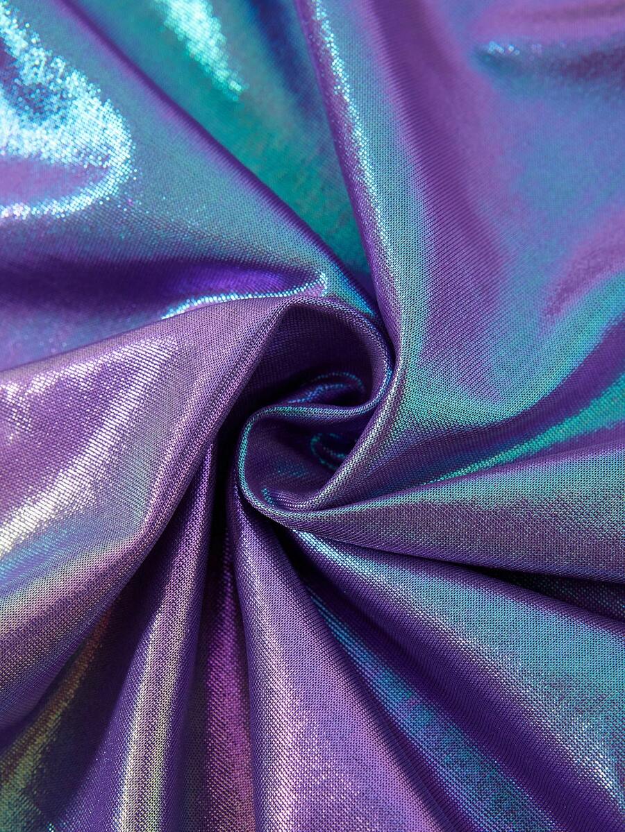 Holographic metallic two-piece set with a spaghetti strap hanky hem crop cami top and drawstring side skirt, featuring ruched details and rhinestone accents.