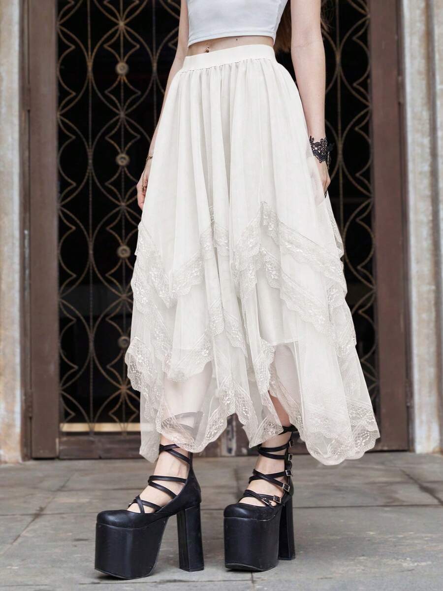 Women's asymmetrical high-waist mesh long skirt featuring contrast lace trim and a tiered A-line silhouette.