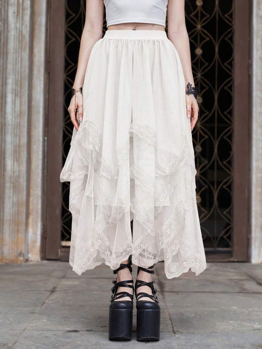 Women's asymmetrical high-waist mesh long skirt featuring contrast lace trim and a tiered A-line silhouette.