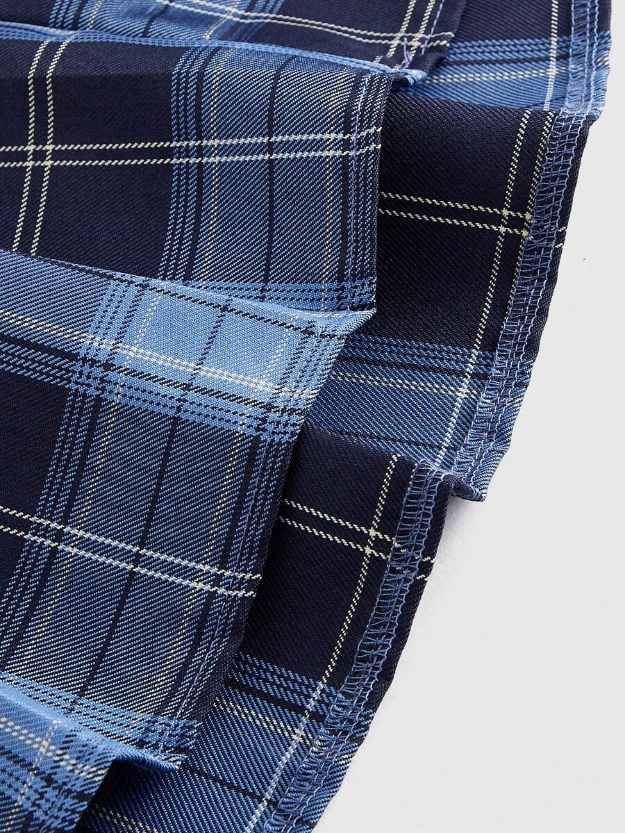 Women's plaid pleated mini skirt featuring an academy style design, mid-rise waist, and side zipper closure.