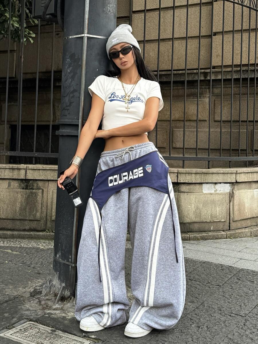 Women's casual grey plaid sweatpants featuring an elastic drawstring waistband, side pockets, and a relaxed loose fit.