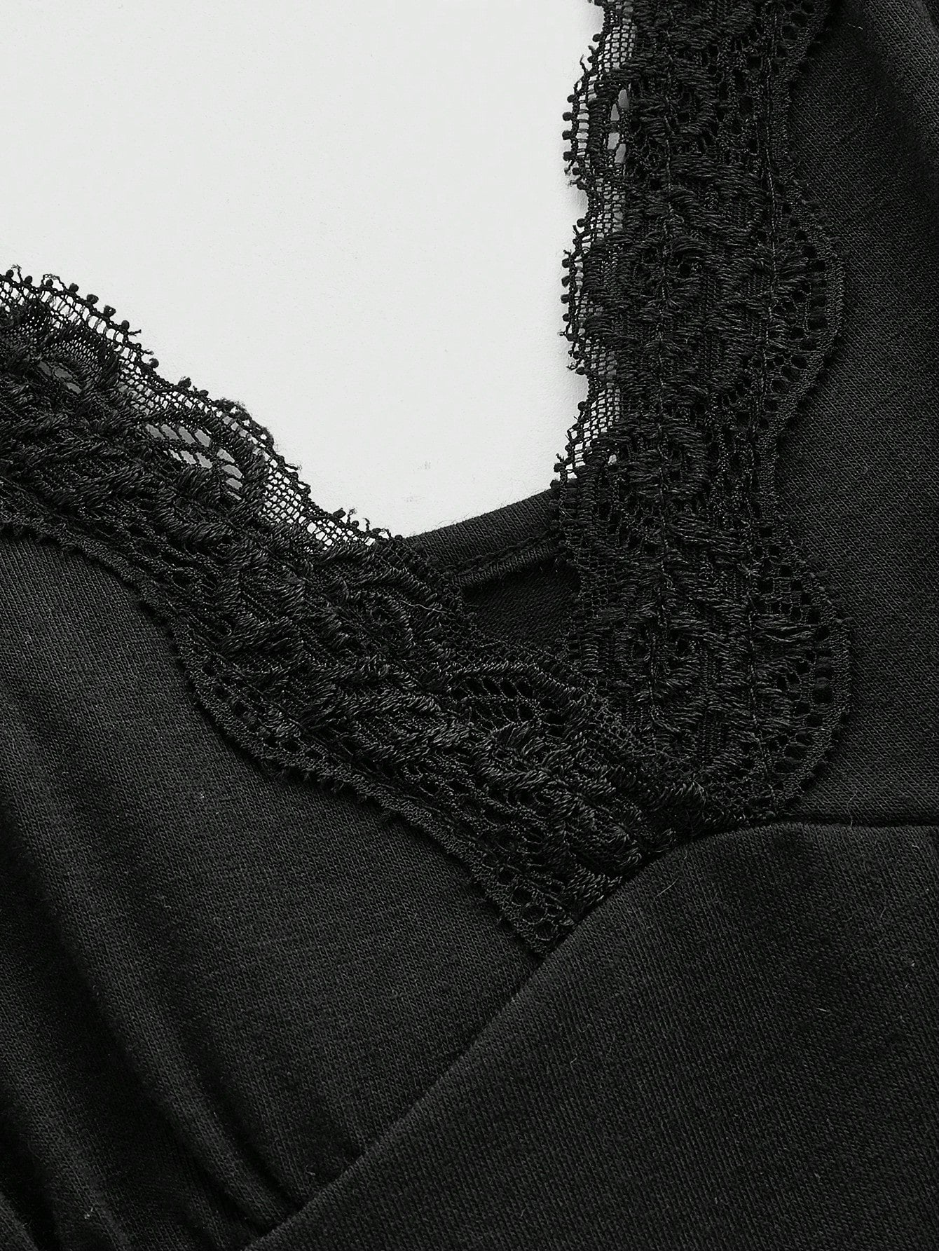 Women's spaghetti strap camisole with contrast lace patchwork, slim fit silhouette, plain design, and flared hem.