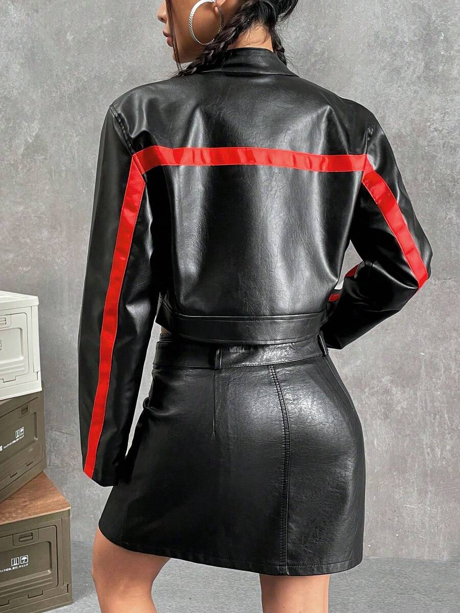 Women's colorblock crop PU leather bomber jacket featuring letter patch accents, a stand collar, and a full zip front closure.