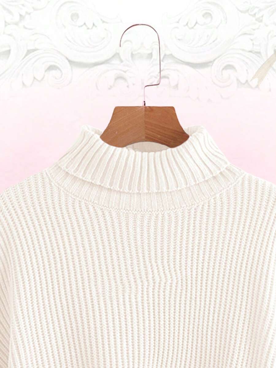 Women's rib-knit crop turtleneck sweater with long drop shoulder sleeves