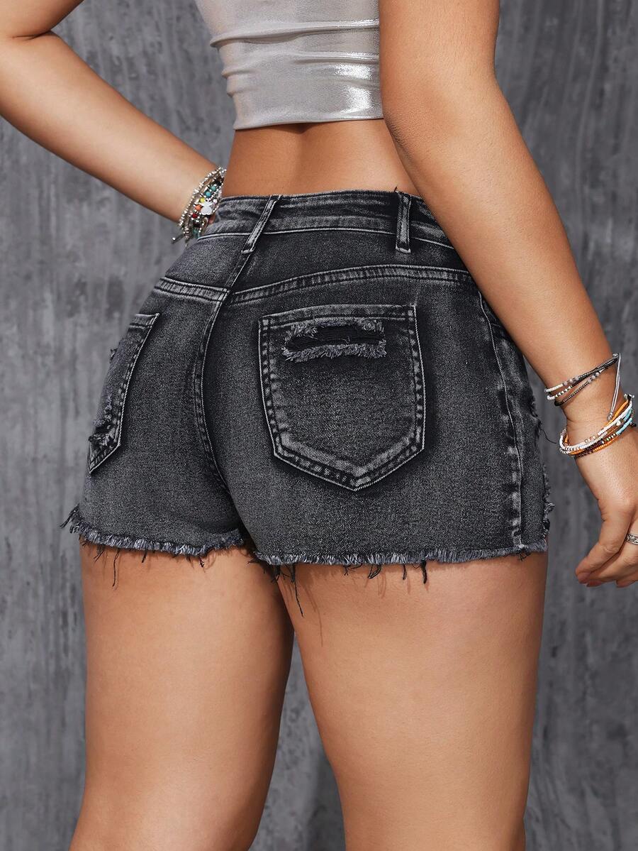 Women's solid color shorts with zipper fly, button closure, pockets, ripped details, and raw hem in a casual straight-leg short length